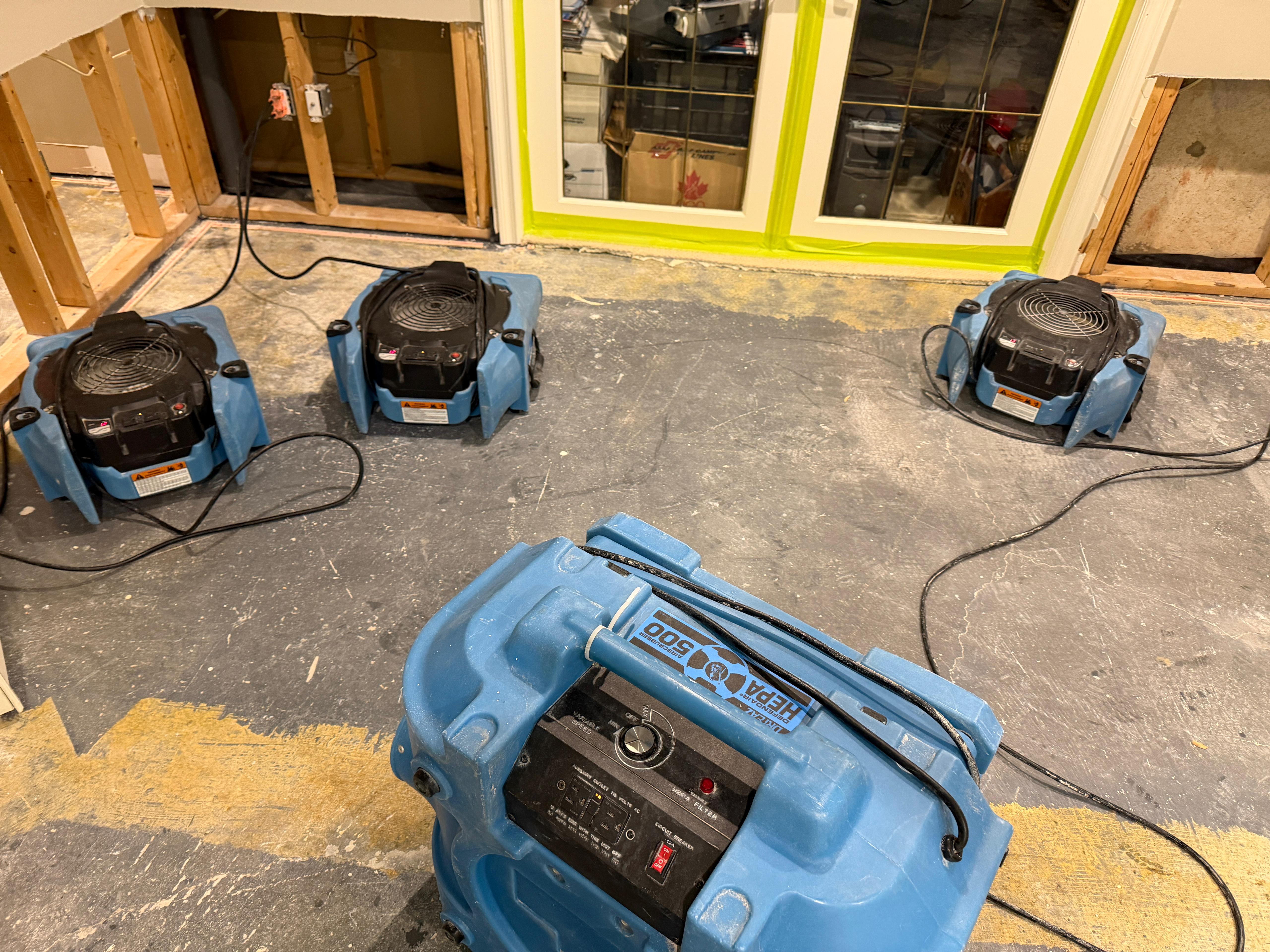 HEPA air scrubber and air movers during active water damage restoration